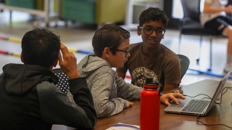 students working on computer